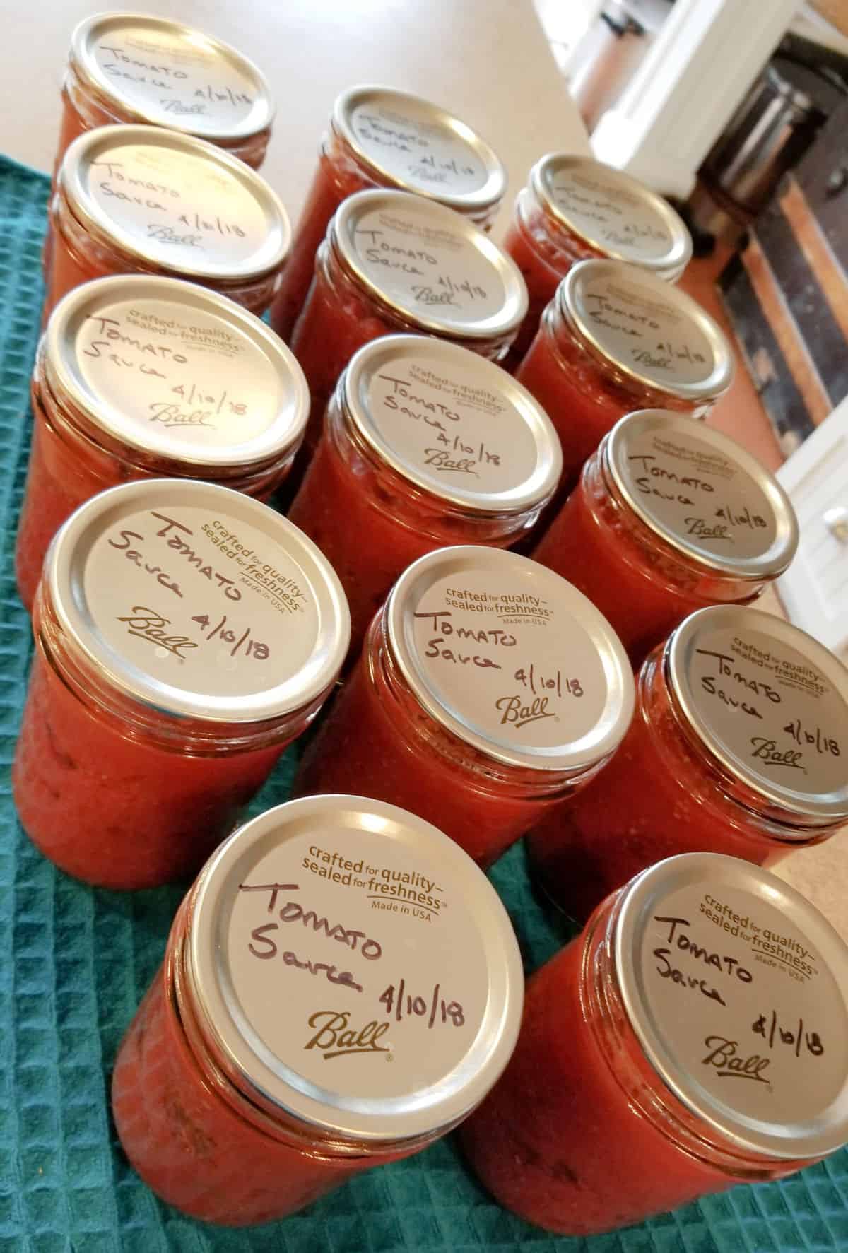 pint jars of canned tomato sauce made from frozen tomatoes