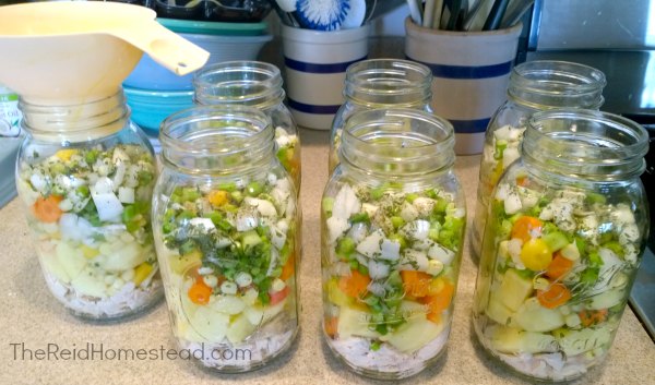 canning jars full of chicken soup ingredients