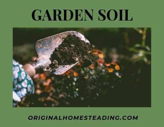 shovel full of soil with text overlay Garden Soil by OriginalHomesteading.com