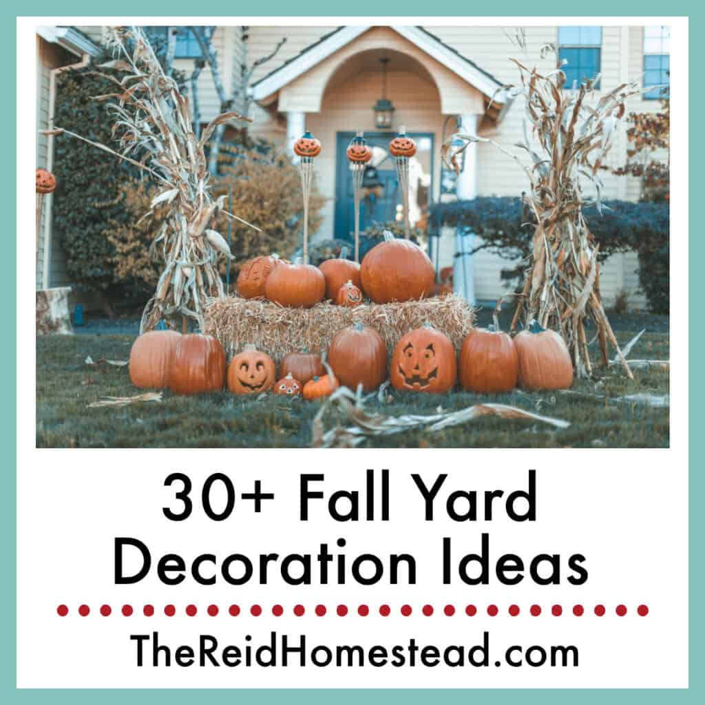 a decorative fall installation in a front yard with hay bales, pumpkins and corn stocks