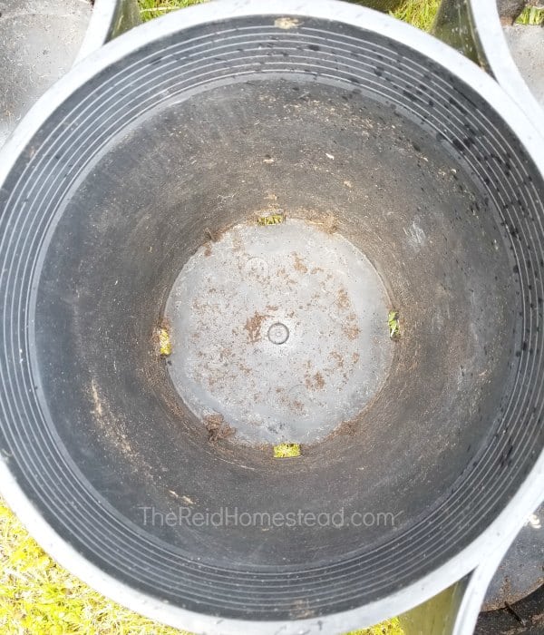 close up view of inside a dirty large planting pot