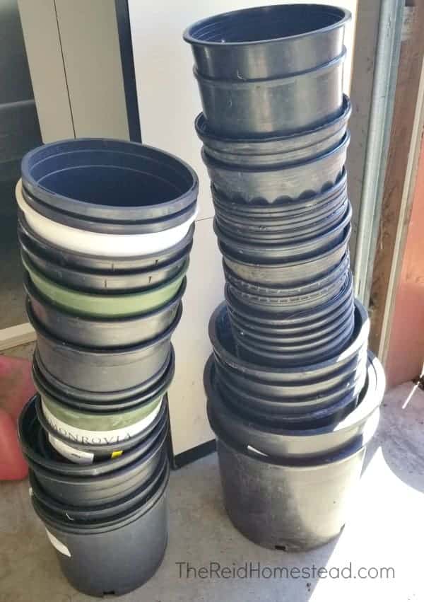 2 tall stacks of large planting pots