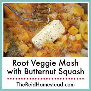 a pot full of chopped and boiled root vegetables and butternut squash with a stick of butter and a potato masher, with text overlay Root Veggie Mash with Butternut Squash Recipe