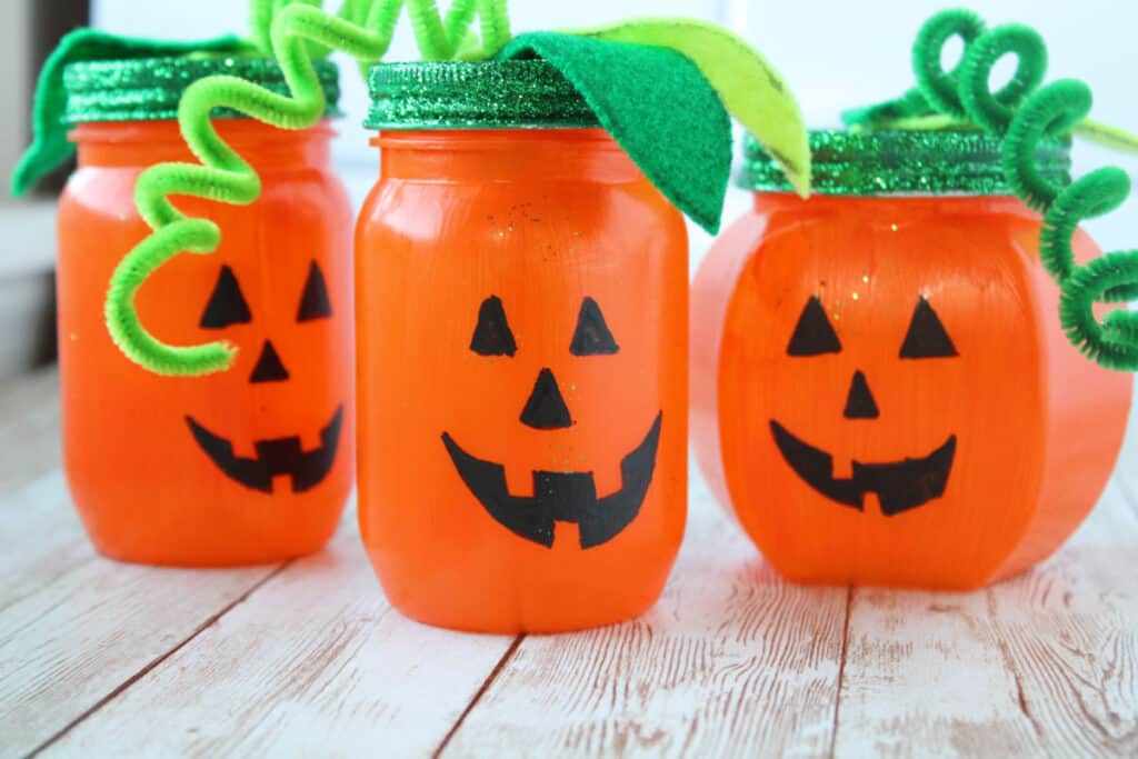 3 finished painted pumpkin mason jars