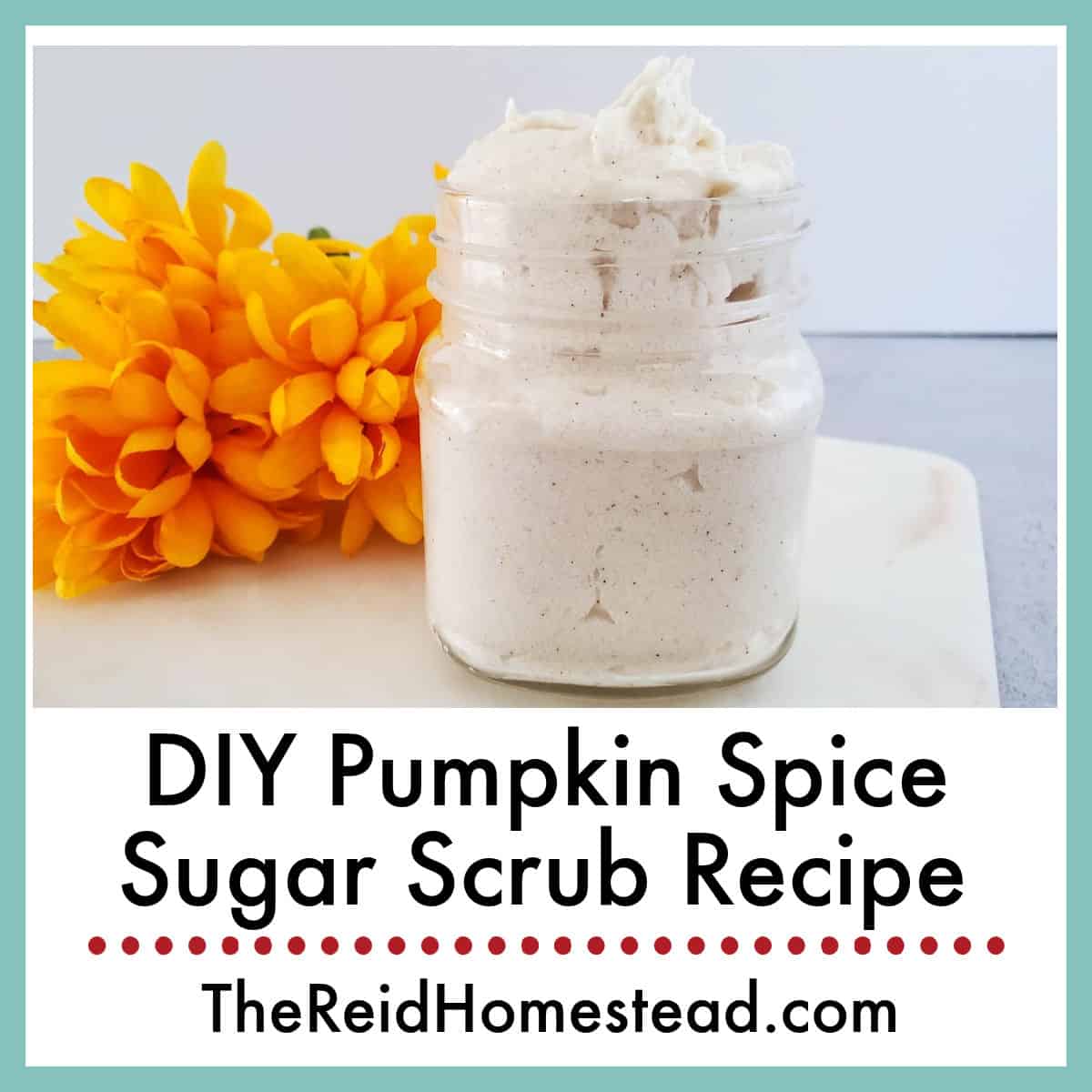 a jar of pumpkin spice sugar scrub next to an orange flower, text overlay DIY Pumpkin Spice Sugar Scrub Recipe