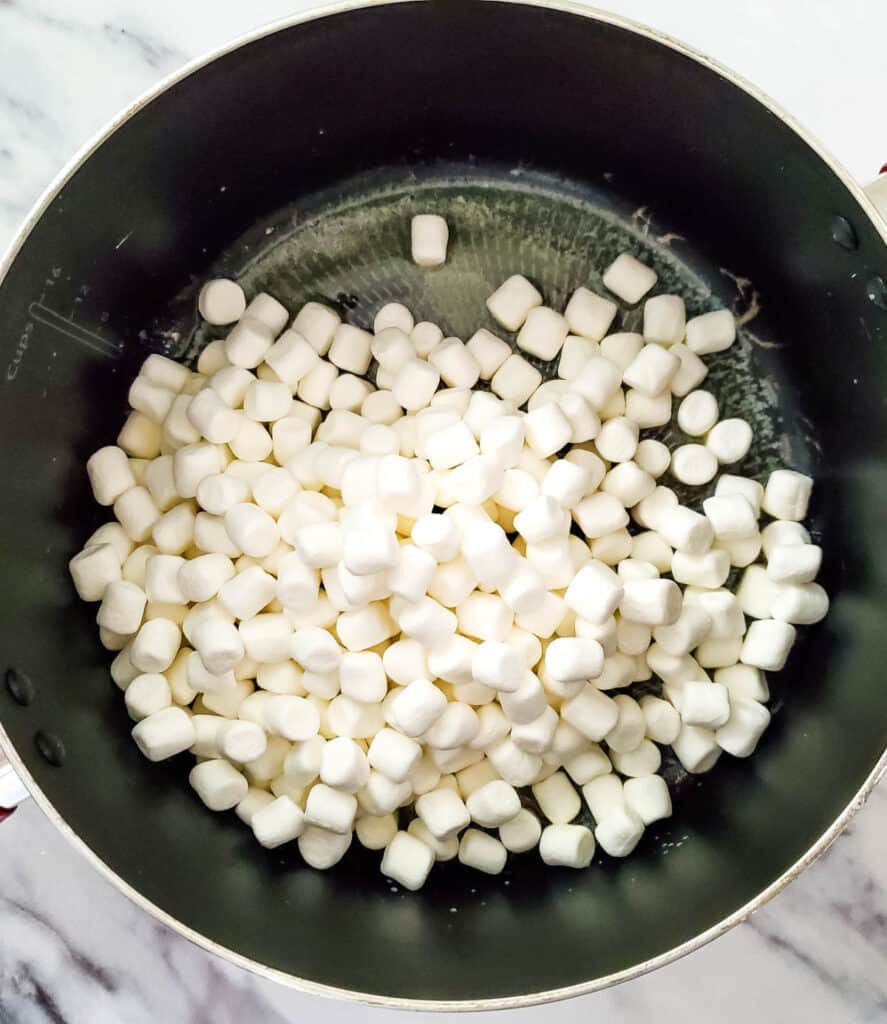 marshmallows added to the pan with melted butter