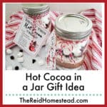 2 jars of hot cocoa mix decorated for gift giving, text overlay Hot Cocoa in a Jar Gift idea