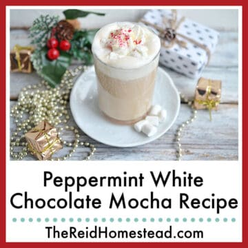 close up of a glass of peppermint white chocolate mocha on a saucer with mini-marshmallows, text overlay Peppermint White Chocolate Mocha Recipe
